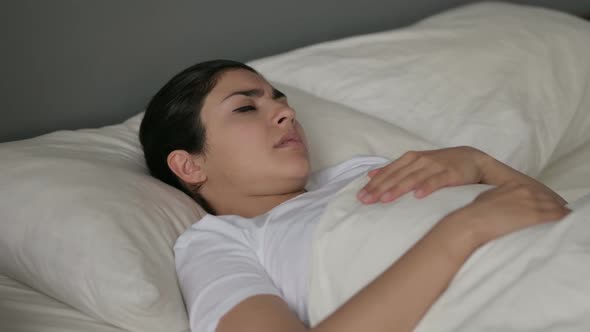 Indian Woman with Cough Laying in Bed 