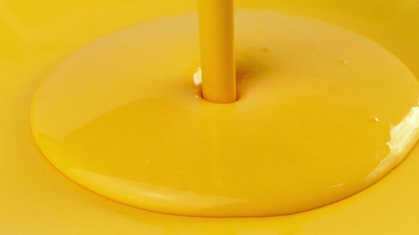 Yellow Paint Pours On Yellow Surface
