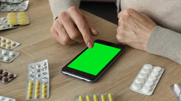 Grandmother Scrolling Smartphone App, Ordering Medicine Online, Green Screen