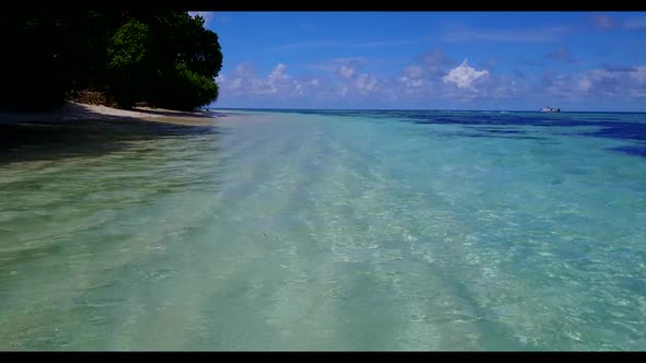 Aerial flying over seascape of perfect island beach trip by blue water and white sand background of 