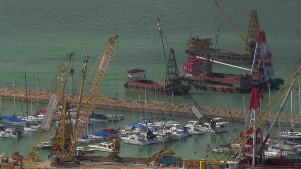 Aerial View of Dock When Contained Barge with Sand By Crane. Hong Kong, China