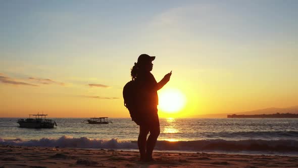 Lady tans on idyllic resort beach wildlife by turquoise ocean and white sandy background of the Mald