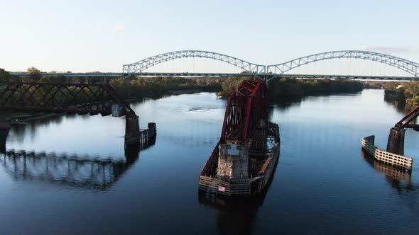 Intense dronefootage of drone flying in between an old rotating railway bridge in Middletown, Connec