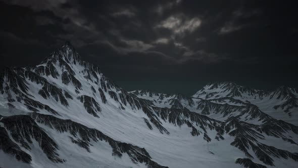 Mountains in Evening Cloudy Sky alt