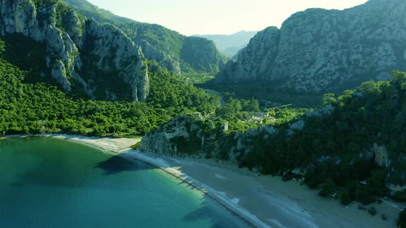 Aerial View of Ancient Olympos Ruins with Valley Between Mountains Antalya Turkey