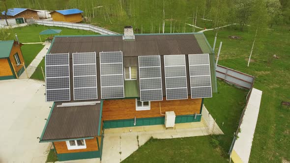Aerial View of Eco-friendly House with Solar Panels Karelian Landscape on Back
