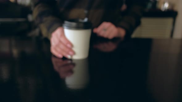 Woman Barista hands give a cup buyer. Concept of Take Away.