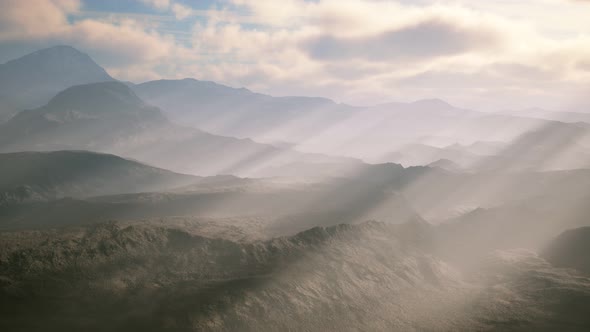 Aerial Vulcanic Desert Landscape with Rays of Light