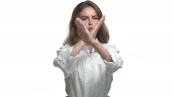 Video of Young Serious Woman in White Collar Shirt Forbid Something Showing Cross Gesture to Stop