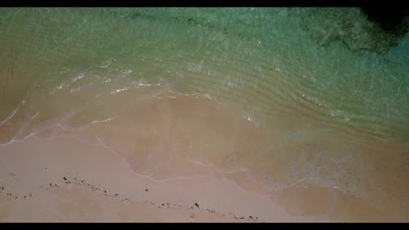 Aerial top down scenery of perfect lagoon beach journey by blue lagoon and clean sandy background of