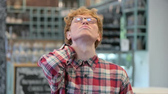 Stressed Young Redhead Man Having Neck Pain