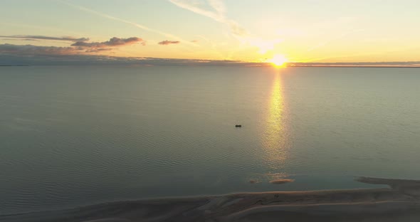 Fishermen with Fishing Boat on Sea Catching Fish at Sunset Aerial View