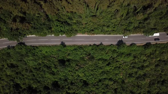 Aerial View From Above of Road with a Car on the Mountain with Green Forest in Russia