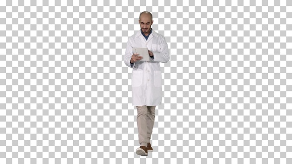 Mature male doctor holding digital tablet using it and walking