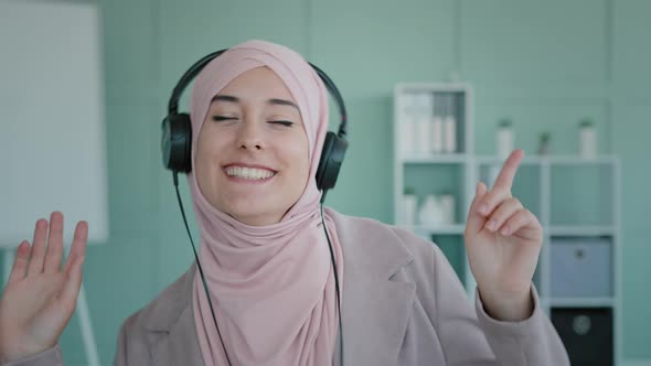 Arab Girl in Pink Hijab Happy Businesswoman Islamic Lady Muslim Woman in Headphones Dancing to