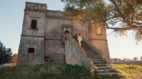 Young girl enters the castle of San Fili