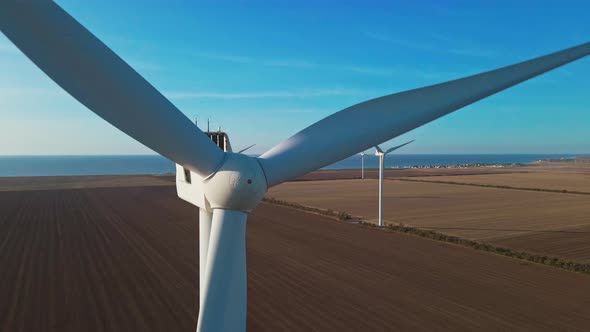 Aerial Zoom Out View of Wind Turbine Farm on Agriculture Fields in Ukraine