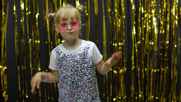 Stylish Child Dancing, Make Faces, Waving Hand in Silly Dance. Little Blonde Kid Girl 4-5 Years Old