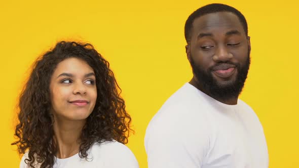 Multiracial Couple Flirting, Love at First Sight, Isolated on Yellow Background