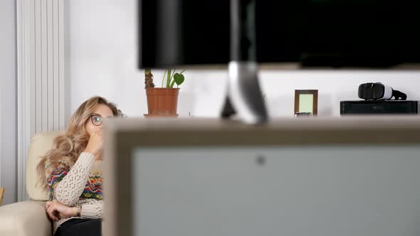 Revealing Shot of Couple Eating Popcorn and Watching TV