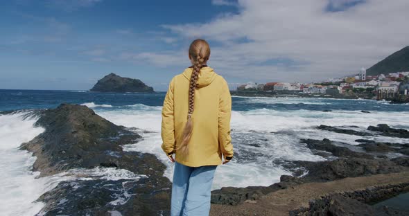 Skinny Poor Young Woman Enjoying the Ocean Storm