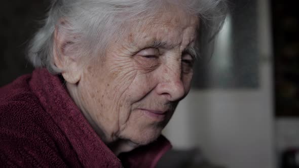 Side View Sad Face Elderly Caucasian Woman With Tremor In Nursing Home