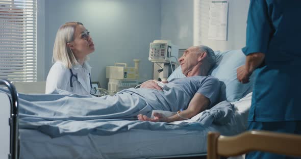 Doctor Visiting Patient in Hospital