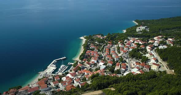 View of houses with boats moored in sea