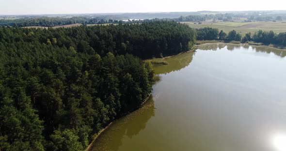 Aerial natural landscape view of Kashubian Pomeranian Lake District Poland, sunny afternoon drone sh