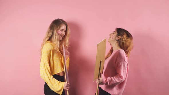 Two Female in Yellow and Pink Blouses Fight for Feminism