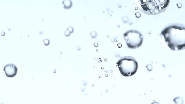 Super Slow Motion Macro Shot of Rising Various Bubbles in Water at 1000 Fps