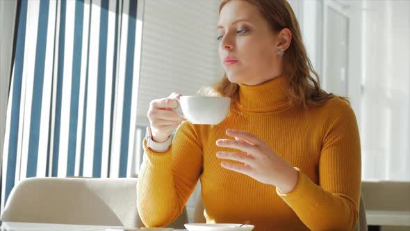 Young Woman in Cafe, Girl Sitting Drinking Coffee, Enjoying Coffee in the Morning