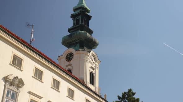 Nitra castle medium shot of old church main historical tower against clear blue sky, Slovakia, centr
