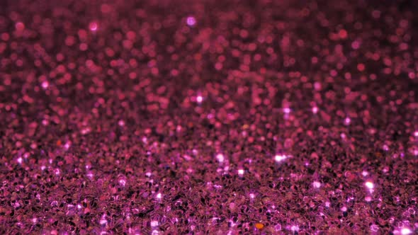 Purple glitter background with sparkling texture.