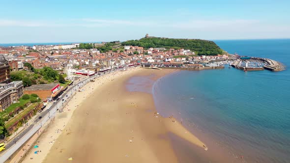 Aerial drone footage of the beach front in the town of Scarborough in North Yorkshire, England UK