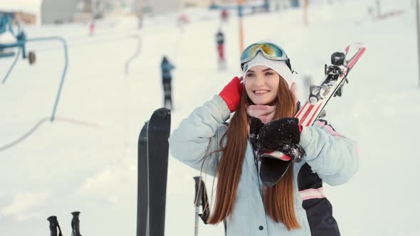 Beautiful Young European Woman in Equipment at Ski Resort