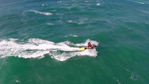 Aerial view of lifeguard surf rescue jet ski personal watercraft in Hawaii