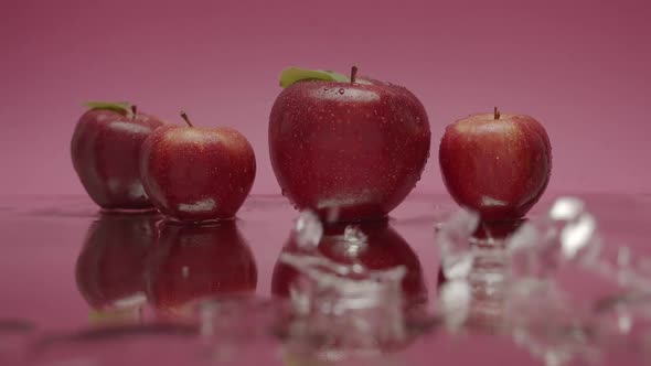 Delicious Red Natural Apples with Water Falling From Above