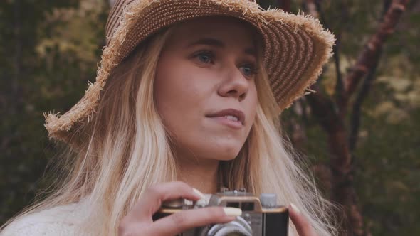 Blond Woman With Vintage Camera