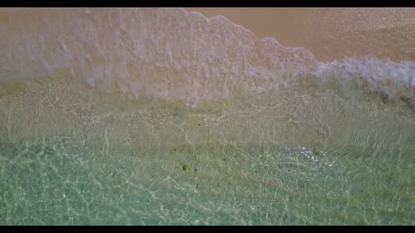 Aerial landscape of luxury sea view beach break by blue lagoon and white sandy background of a picni