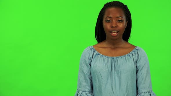 A Young Black Woman Talks To the Camera - Green Screen Studio