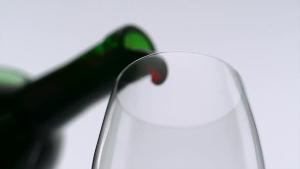 Pouring red wine into glass, Slow Motion