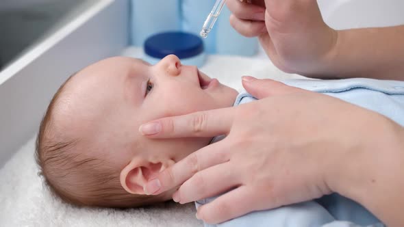 Curing Baby with Runny Nose Using Medication in Droplets From Runny Nose