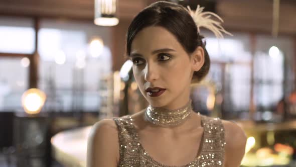 Closeup Portrait of a Young Attractive Woman in a 1920s Style at the Bar