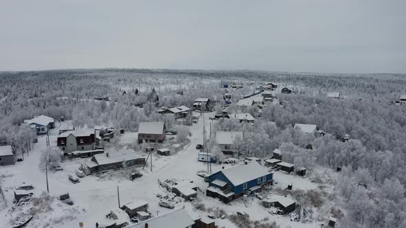 Snowcovered Village in the Forest