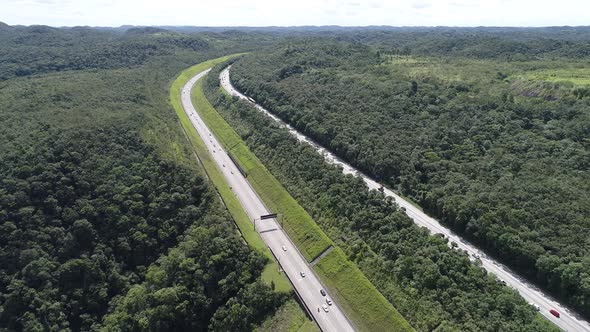 Construction landscape of highway road between green mountains.