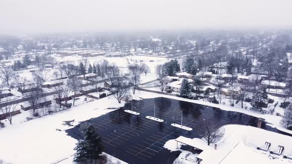 4K drone video of melted parking lot in suburbs of Grand Rapids, Michigan