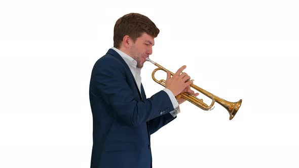 Young Man in Suit Playing a Trumpet While Walking on White Background