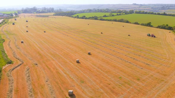 Heavy agricultural machinery moving on agricultural field 4k