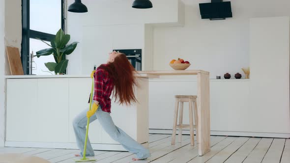 Active Happy Caucasian Housewife Amusing Young Redhead Woman with Long Hair Energetic Dancer Moving